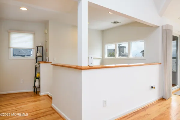 a view of a dining area with furniture and kitchen view