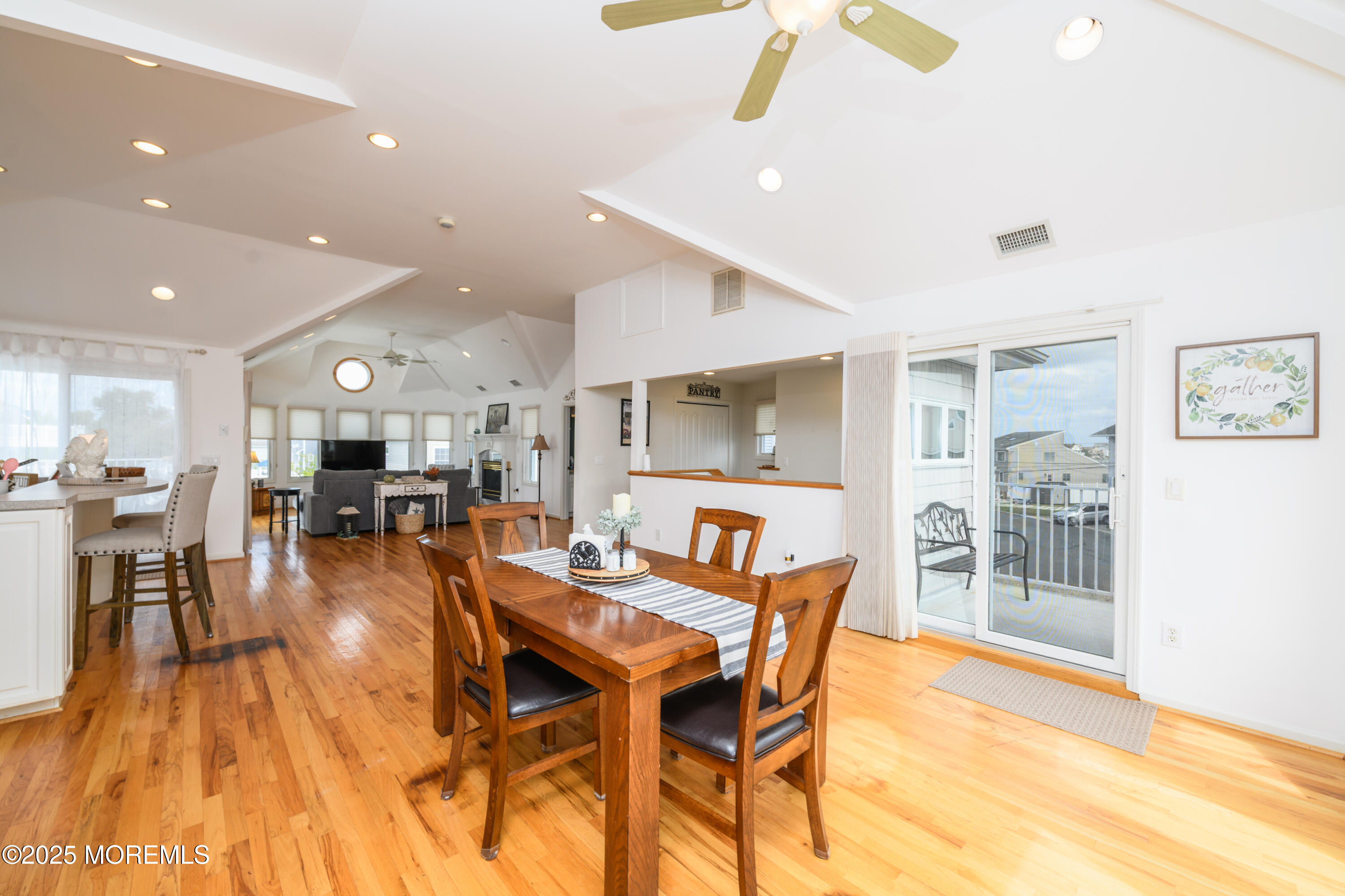 42 Bay Breeze Drive Toms River, NJ 08753 - Photo 20 of 33 a dining room with stainless steel appliances kitchen island granite countertop a dining table chairs and view living room