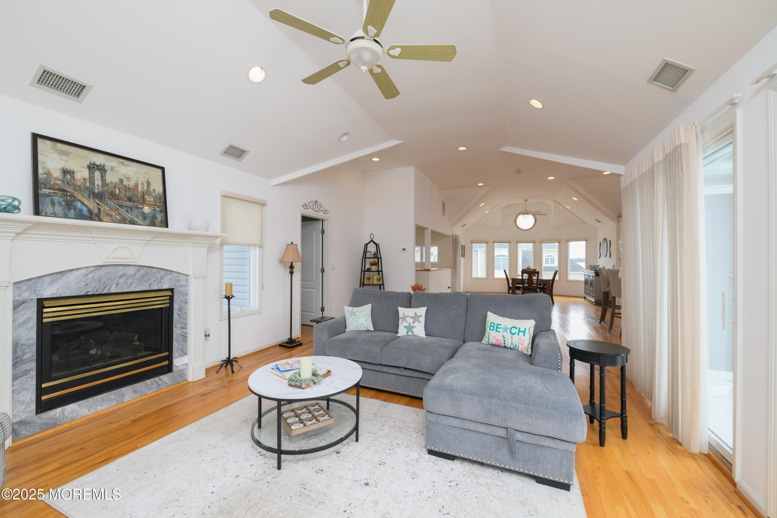 42 Bay Breeze Drive Toms River, NJ 08753 - Photo 25 of 33 a living room with furniture and a fireplace