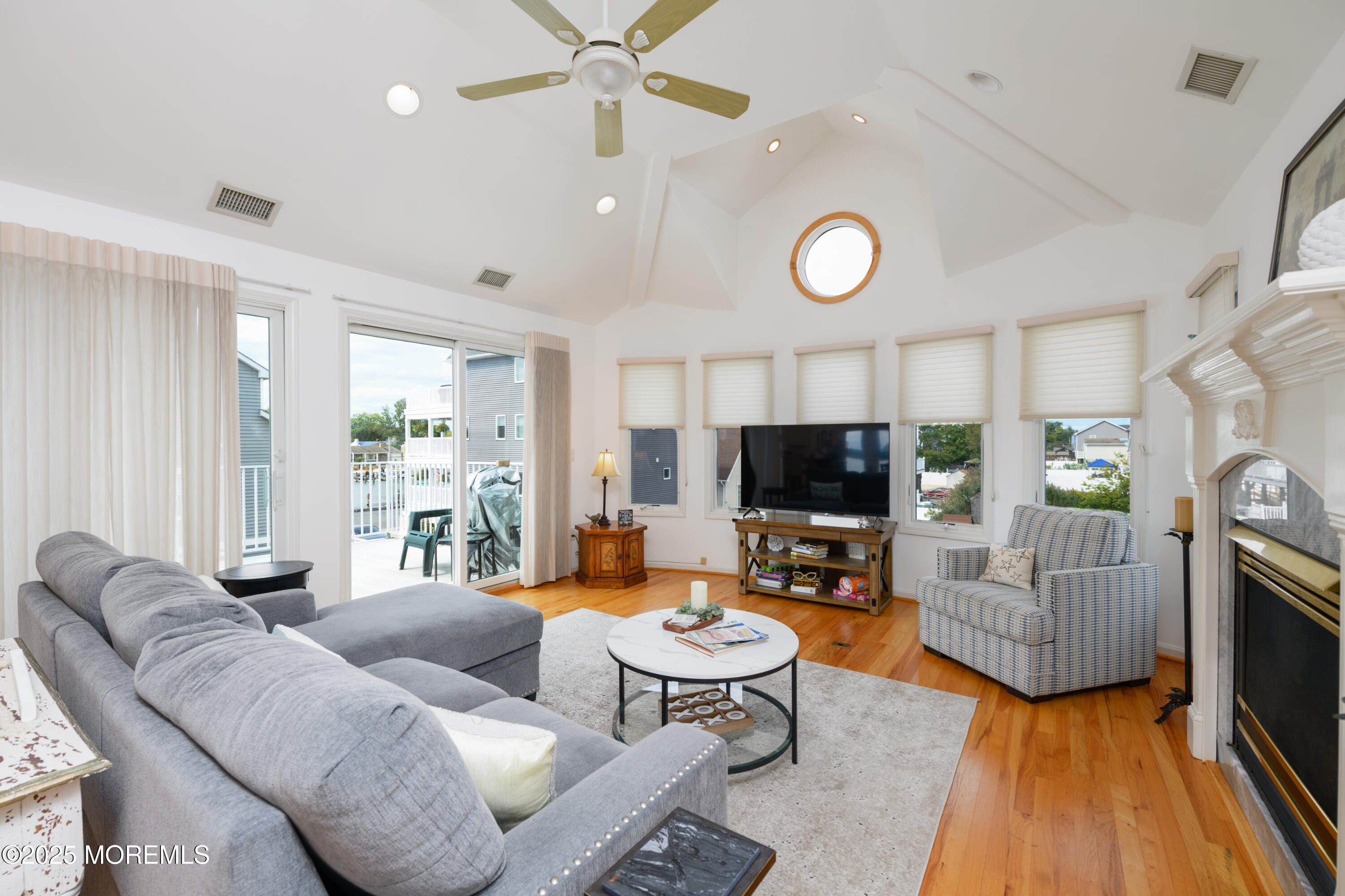 42 Bay Breeze Drive Toms River, NJ 08753 - Photo 26 of 33 a living room with furniture and a flat screen tv