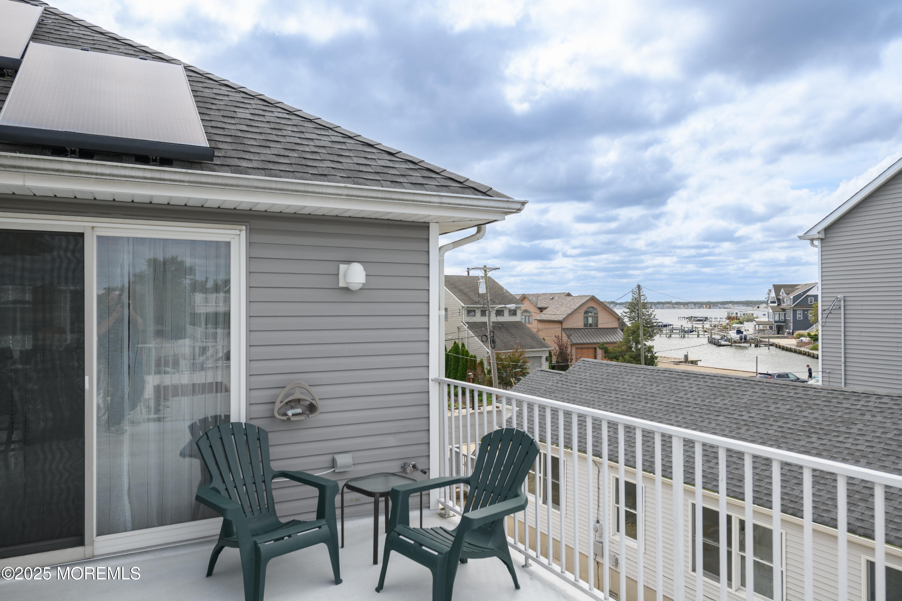 42 Bay Breeze Drive Toms River, NJ 08753 - Photo 27 of 33 a view of a chair and table in the balcony