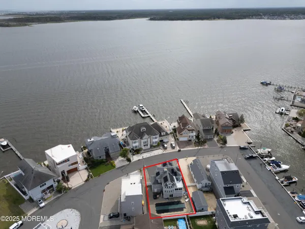 a bedroom with a bed and glass door