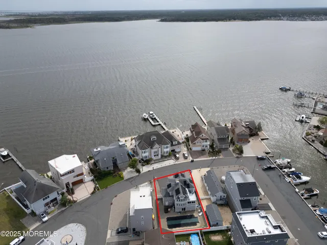 a bedroom with a bed and glass door