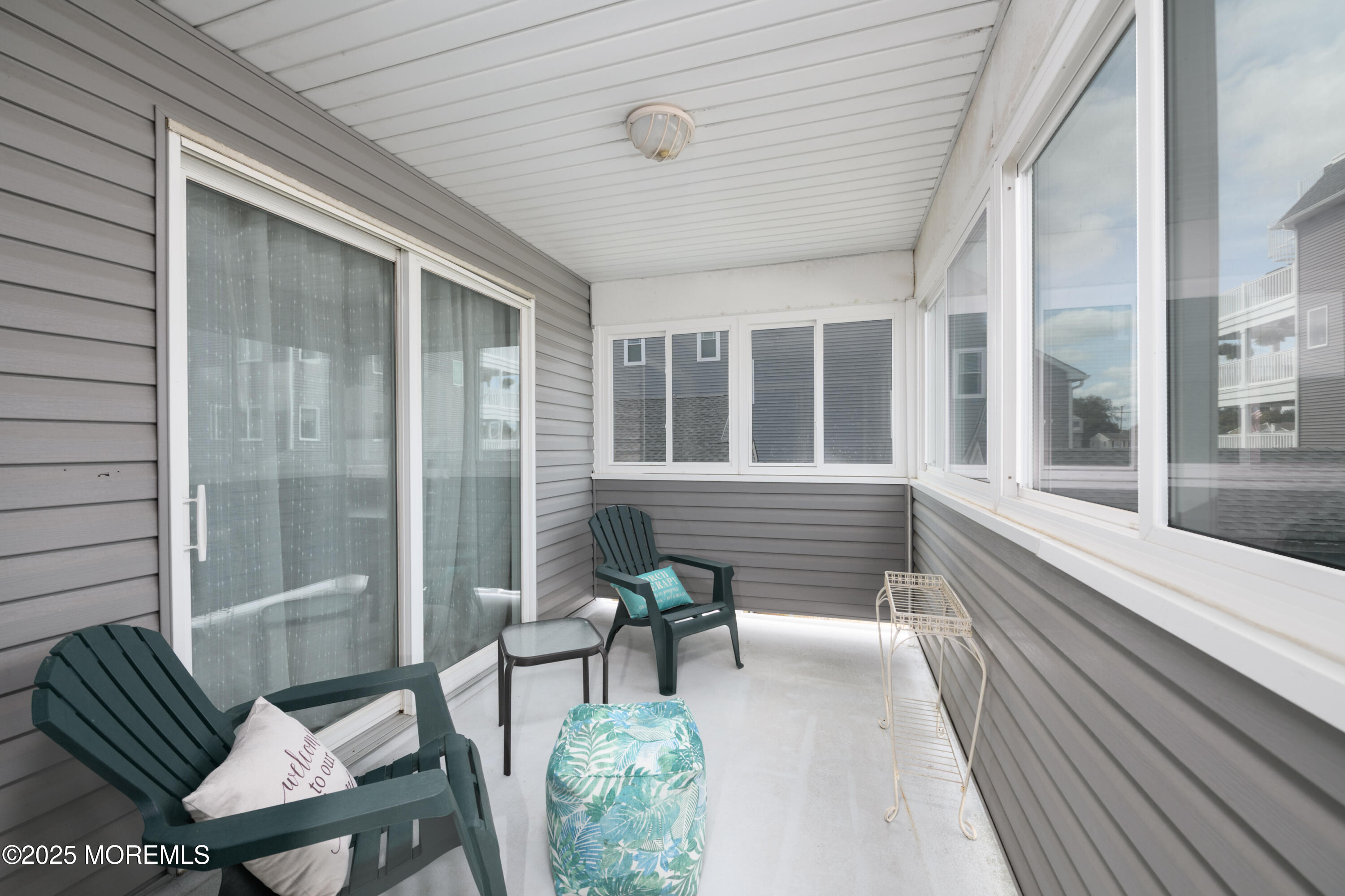 42 Bay Breeze Drive Toms River, NJ 08753 - Photo 9 of 33 a balcony with furniture and a potted plant