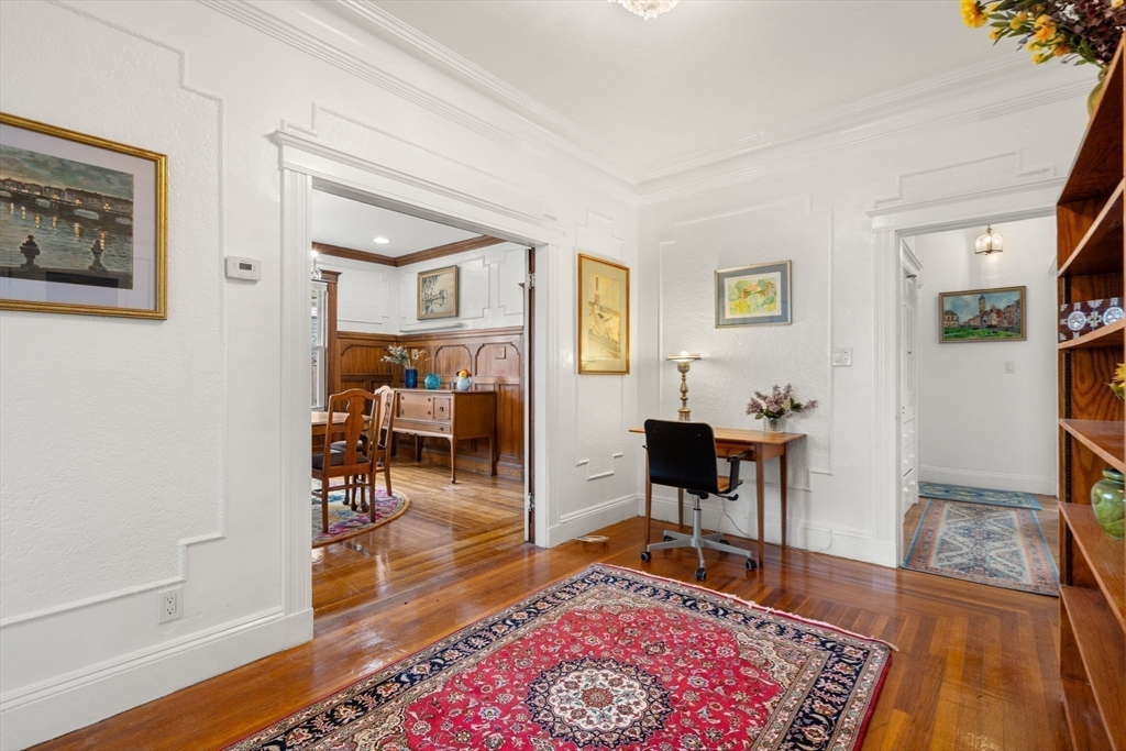21 Colbourne Crescent, Unit 1 Brookline, MA 02445 - Photo 12 of 35 a living room with furniture and a rug