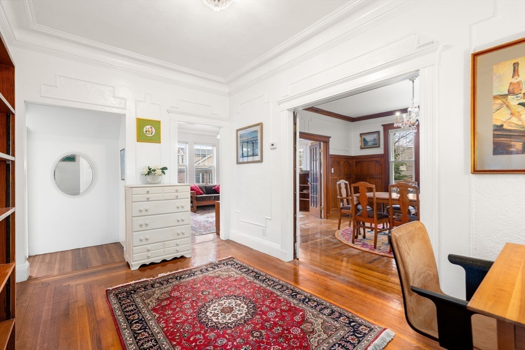 21 Colbourne Crescent, Unit 1 Brookline, MA 02445 - Photo 13 of 35 a living room with furniture and wooden floor