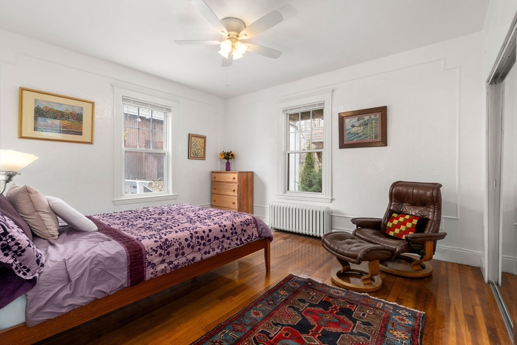 21 Colbourne Crescent, Unit 1 Brookline, MA 02445 - Photo 14 of 35 a bedroom with a bed and a window