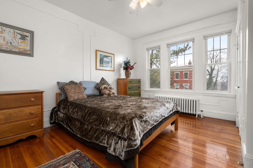 21 Colbourne Crescent, Unit 1 Brookline, MA 02445 - Photo 15 of 35 a bed sitting in a bedroom next to a window