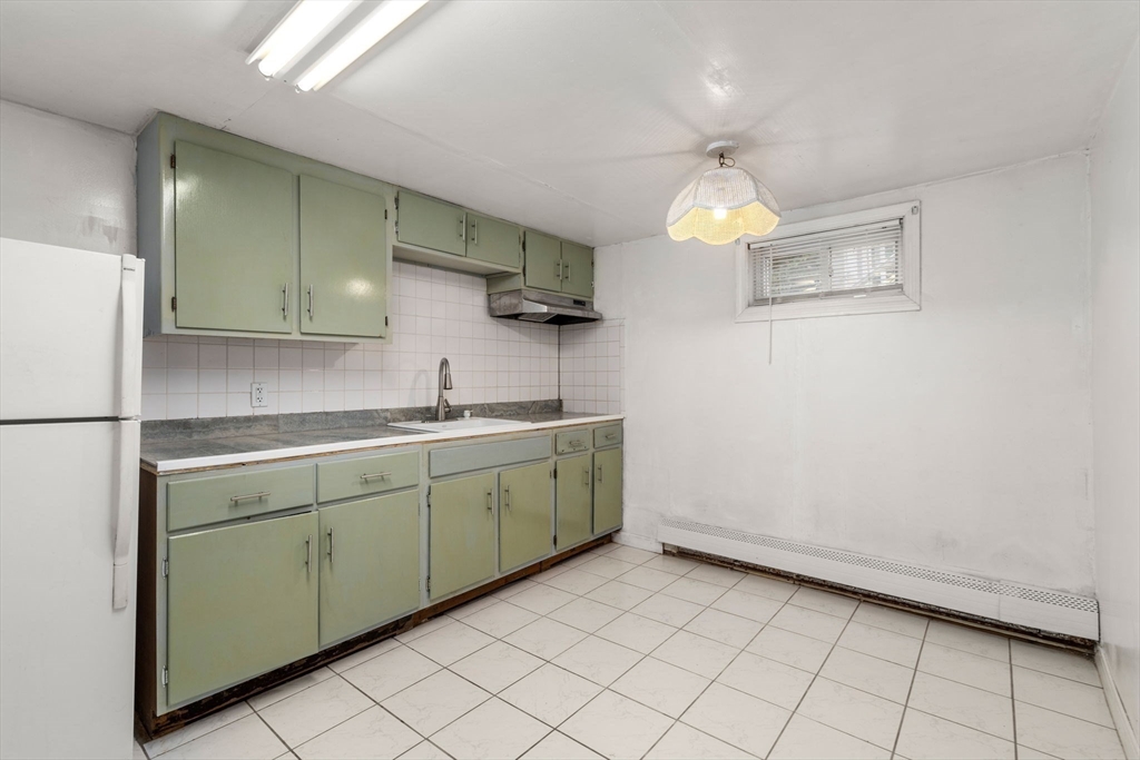 21 Colbourne Crescent, Unit 1 Brookline, MA 02445 - Photo 21 of 35 a kitchen with a sink cabinets and appliances