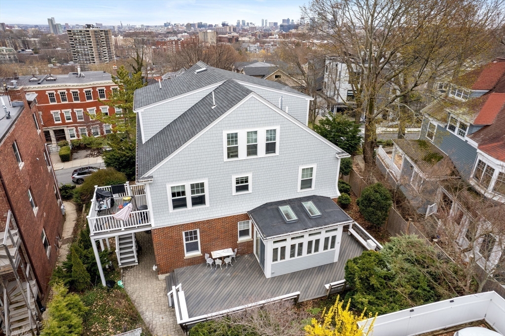 21 Colbourne Crescent, Unit 1 Brookline, MA 02445 - Photo 32 of 35 a front view of a house with a yard