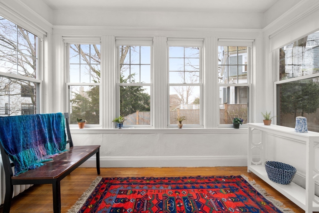 21 Colbourne Crescent, Unit 1 Brookline, MA 02445 - Photo 4 of 35 a living room with furniture and a window