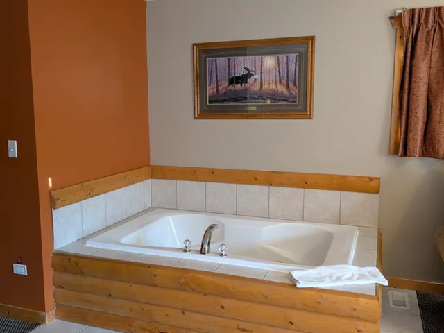 a bathroom with a sink and mirror