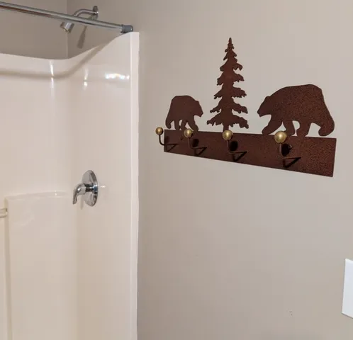 a bathroom with a shower curtain and toilet