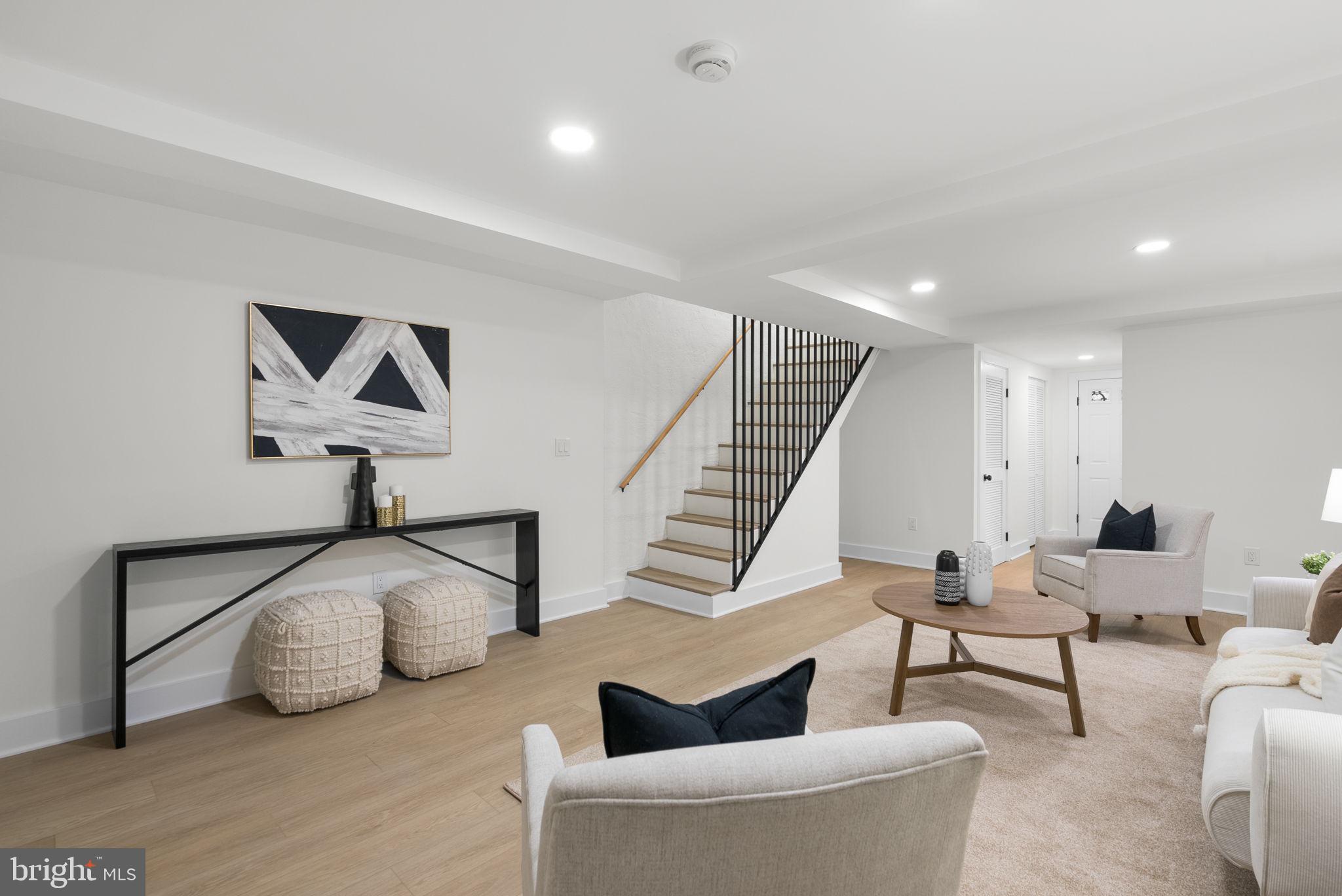 6328 North Capitol Street Northwest Washington, DC 20011 - Photo 21 of 34 a living room with furniture and a painting on the wall