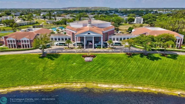 an aerial view of a house with a swimming pool