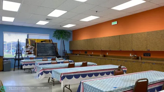 a room with furniture a large window and a table