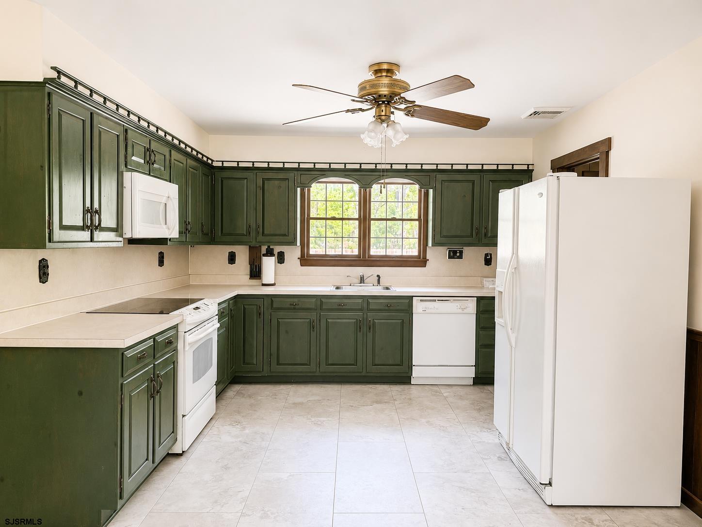 40 Old New York Road Galloway Township, NJ 08205 - Photo 4 of 18 a kitchen with a sink cabinets and window