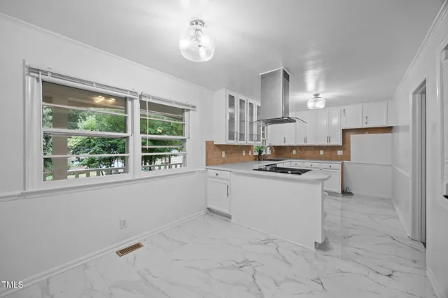 a kitchen with a stove a sink and a refrigerator