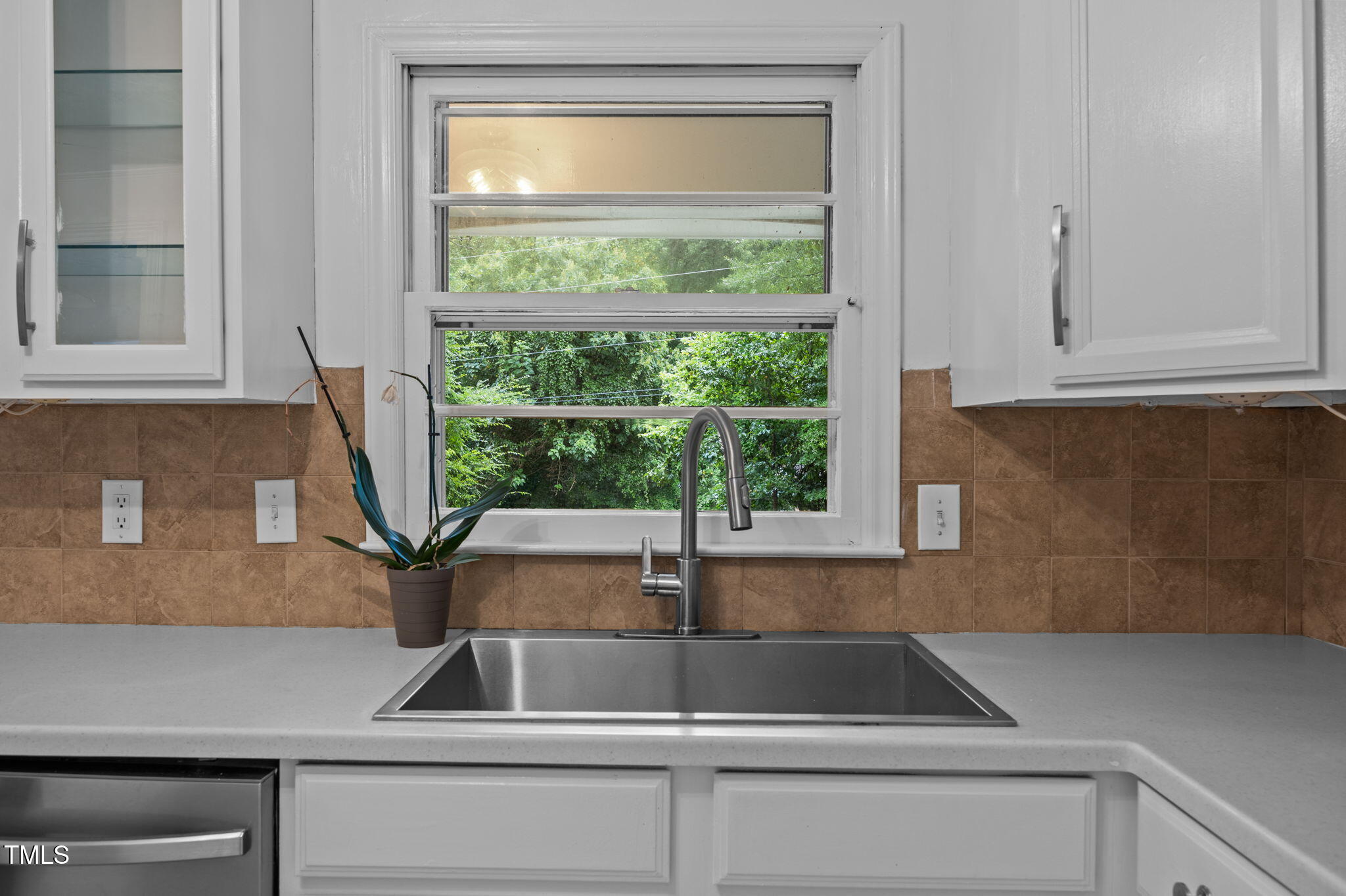 131 Creech Road Garner, NC 27529 - Photo 12 of 29 a kitchen sink sitting next to a window