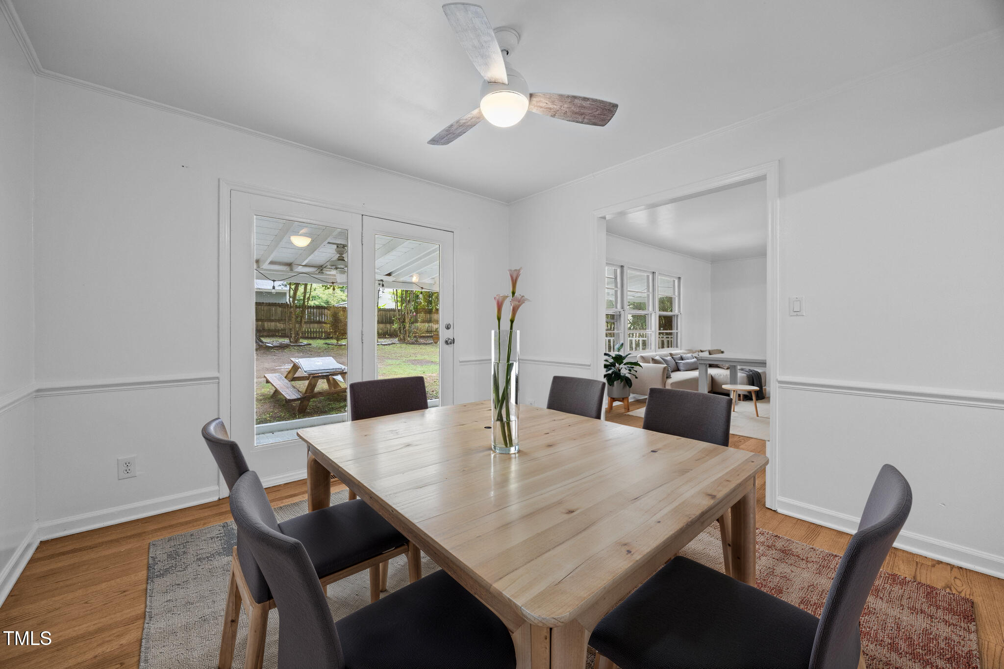 131 Creech Road Garner, NC 27529 - Photo 9 of 29 a view of a dining room with furniture and wooden floor