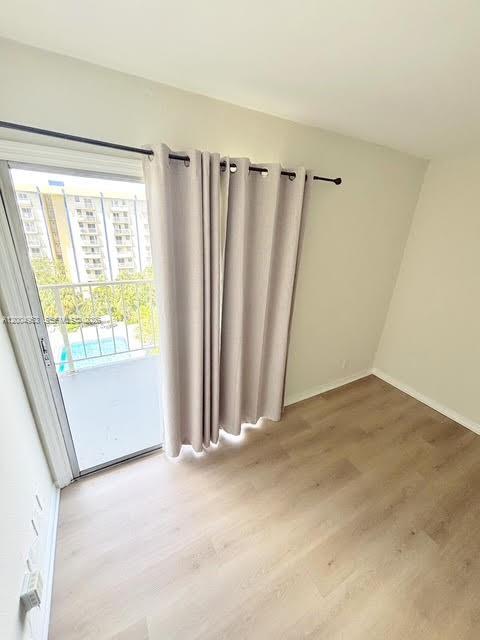 4550 Northwest 9th Street, Unit 803E Miami, FL 33126 - Photo 11 of 31 a view of an empty room with a window