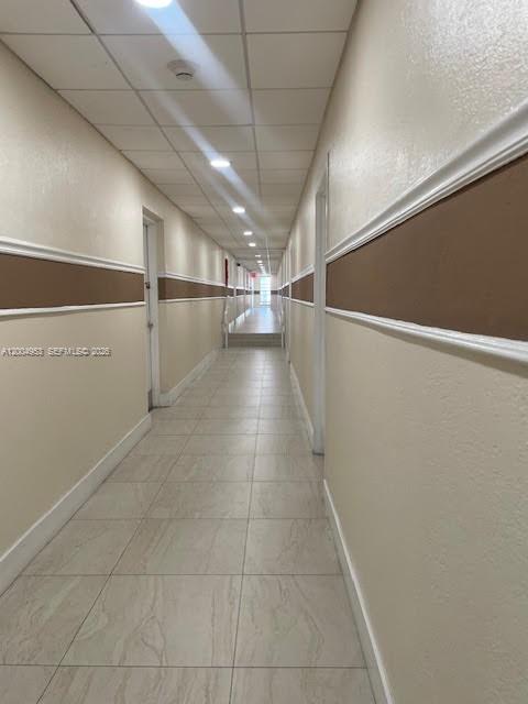 4550 Northwest 9th Street, Unit 803E Miami, FL 33126 - Photo 18 of 31 a view of a room with racks on the wall