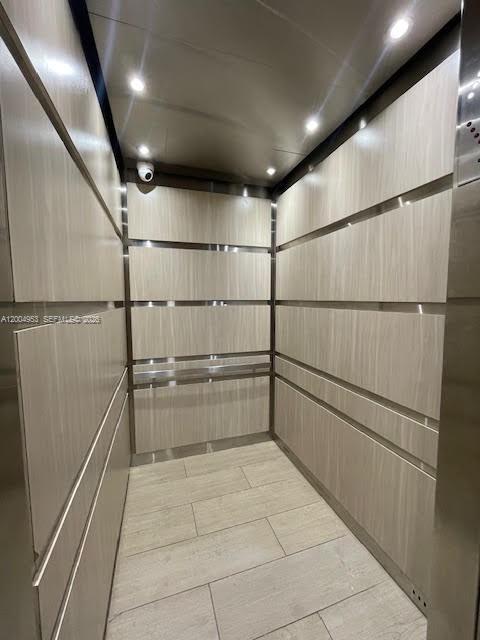 4550 Northwest 9th Street, Unit 803E Miami, FL 33126 - Photo 21 of 31 a storage and utility room with wooden floor