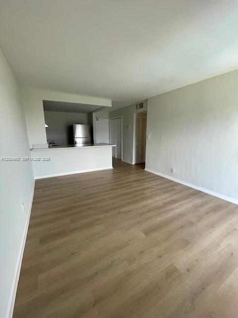 4550 Northwest 9th Street, Unit 803E Miami, FL 33126 - Photo 10 of 31 a view of a livingroom with wooden floor