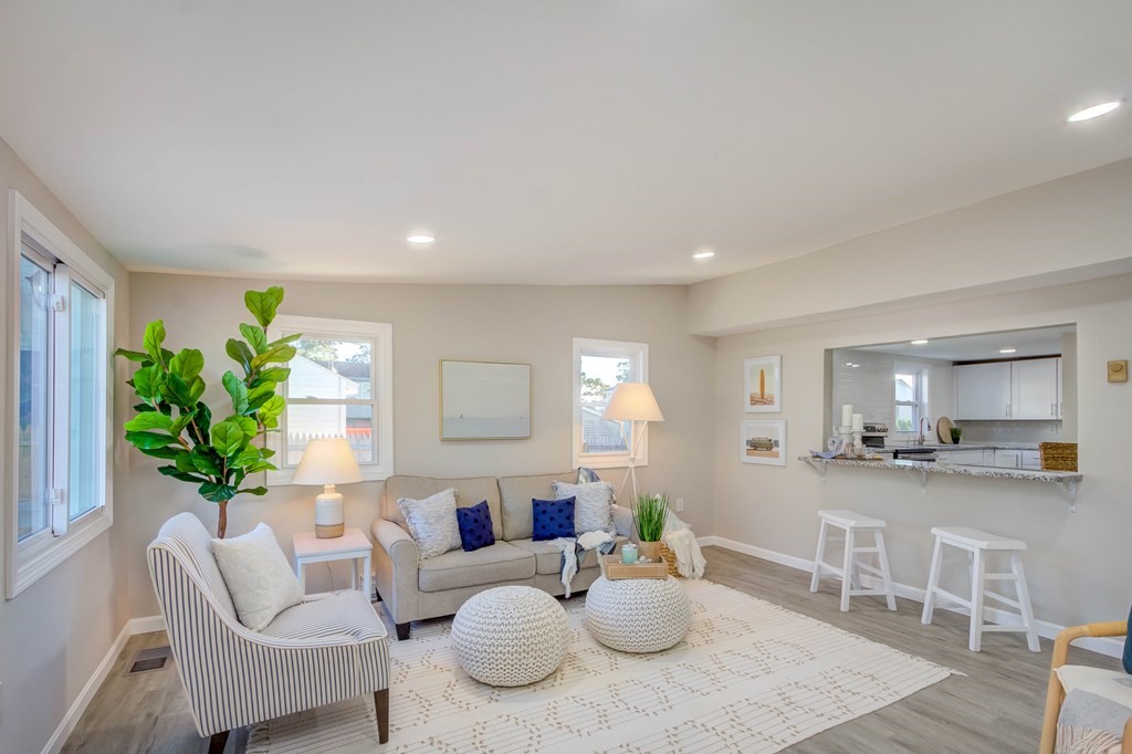 14 Pinehurst Drive Wareham, MA 02571 - Photo 15 of 39 a living room with furniture and a dining table with wooden floor