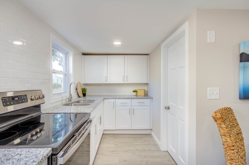 14 Pinehurst Drive Wareham, MA 02571 - Photo 29 of 39 a kitchen with stainless steel appliances granite countertop a stove a sink and a refrigerator