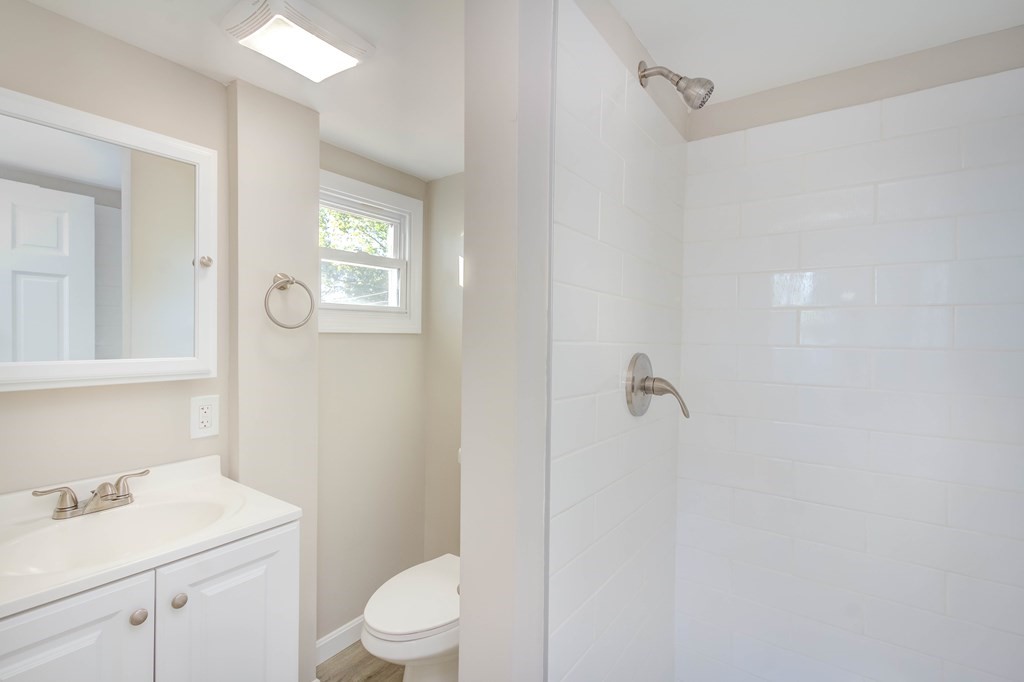 14 Pinehurst Drive Wareham, MA 02571 - Photo 31 of 39 a bathroom with a sink a toilet and shower