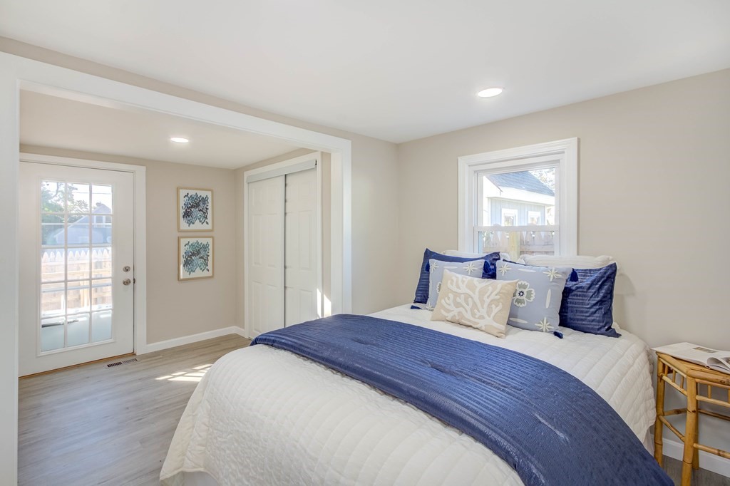 14 Pinehurst Drive Wareham, MA 02571 - Photo 32 of 39 a bedroom with a large bed and wooden floor