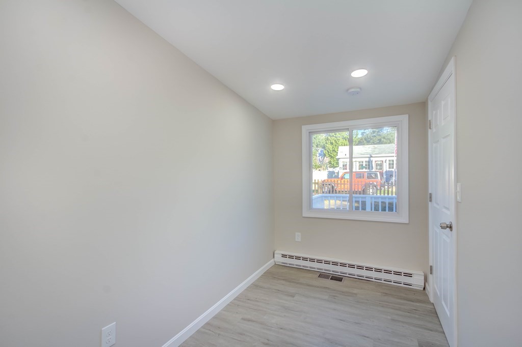 14 Pinehurst Drive Wareham, MA 02571 - Photo 38 of 39 an empty room with wooden floor and windows