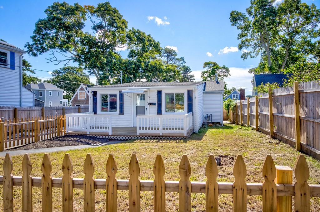 14 Pinehurst Drive Wareham, MA 02571 - Photo 8 of 39 a view of a house with a wooden fence