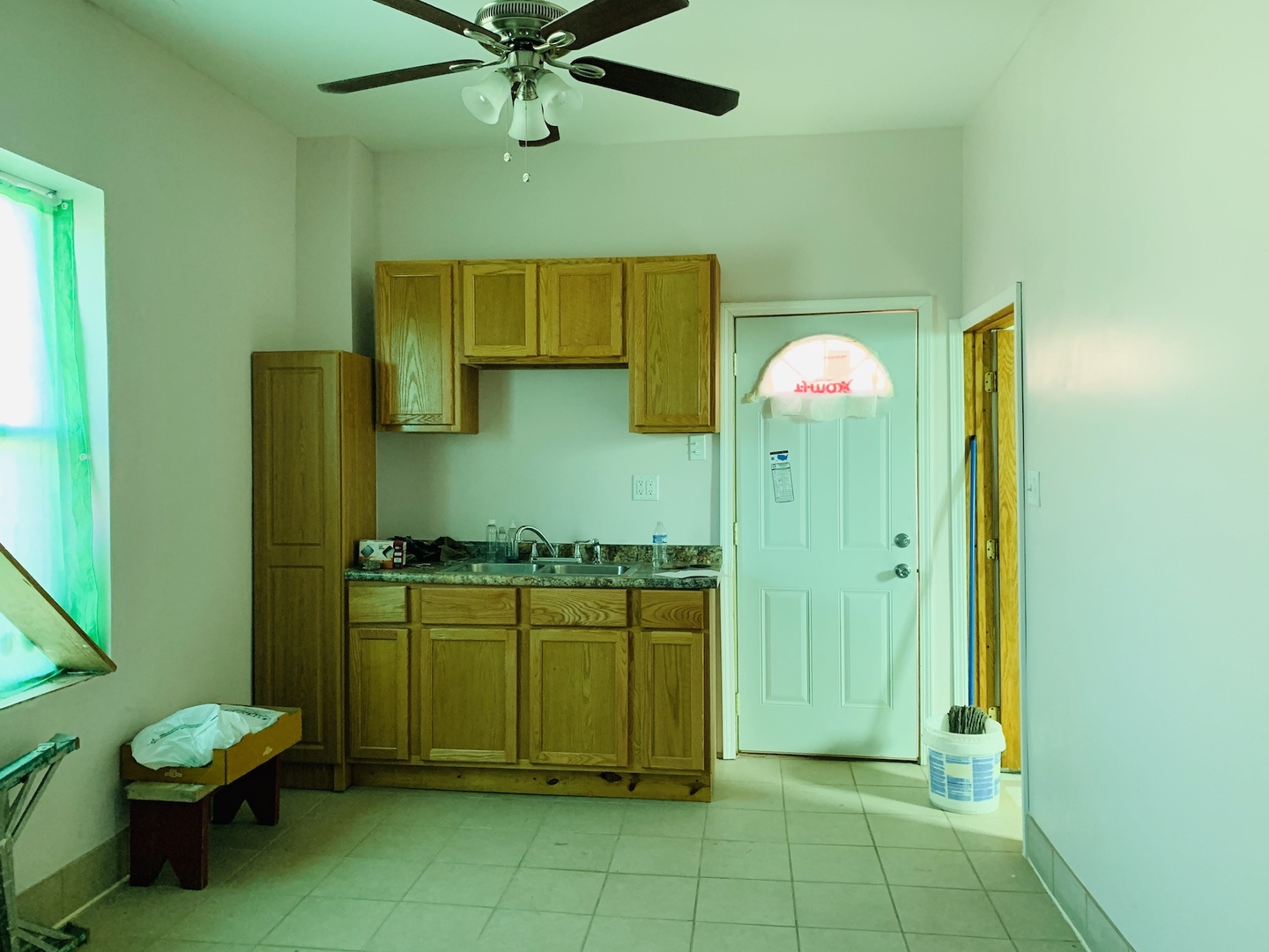 317 East 116th Street Chicago, IL 60628 - Photo 14 of 17 a kitchen with a refrigerator a washer and dryer