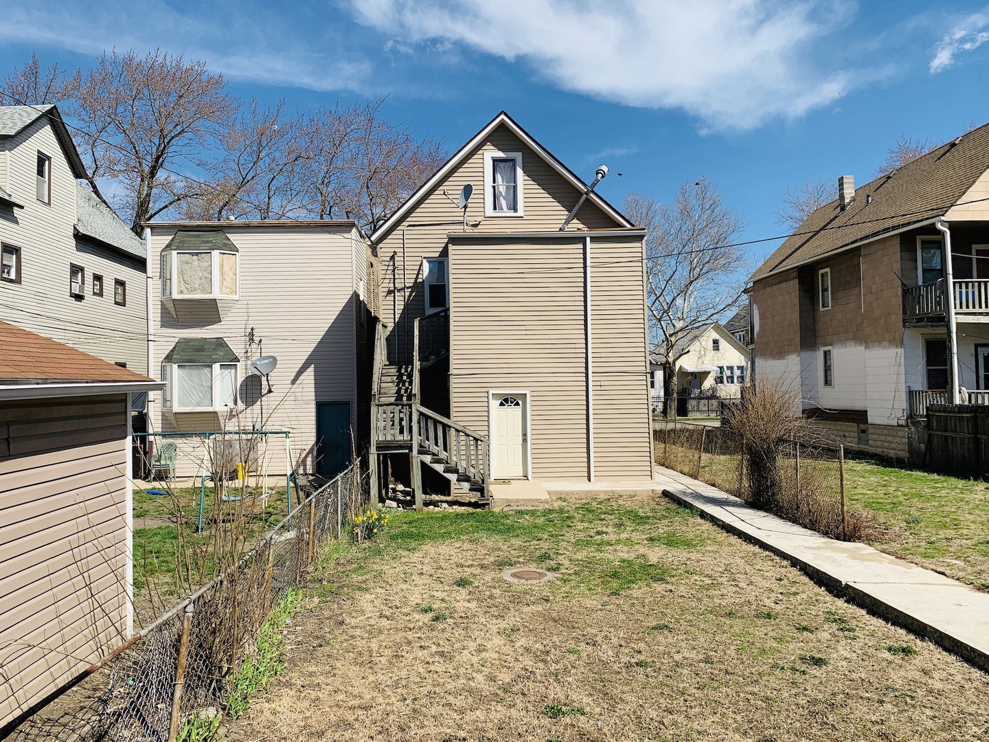 317 East 116th Street Chicago, IL 60628 - Photo 17 of 17 a front view of a house with garden