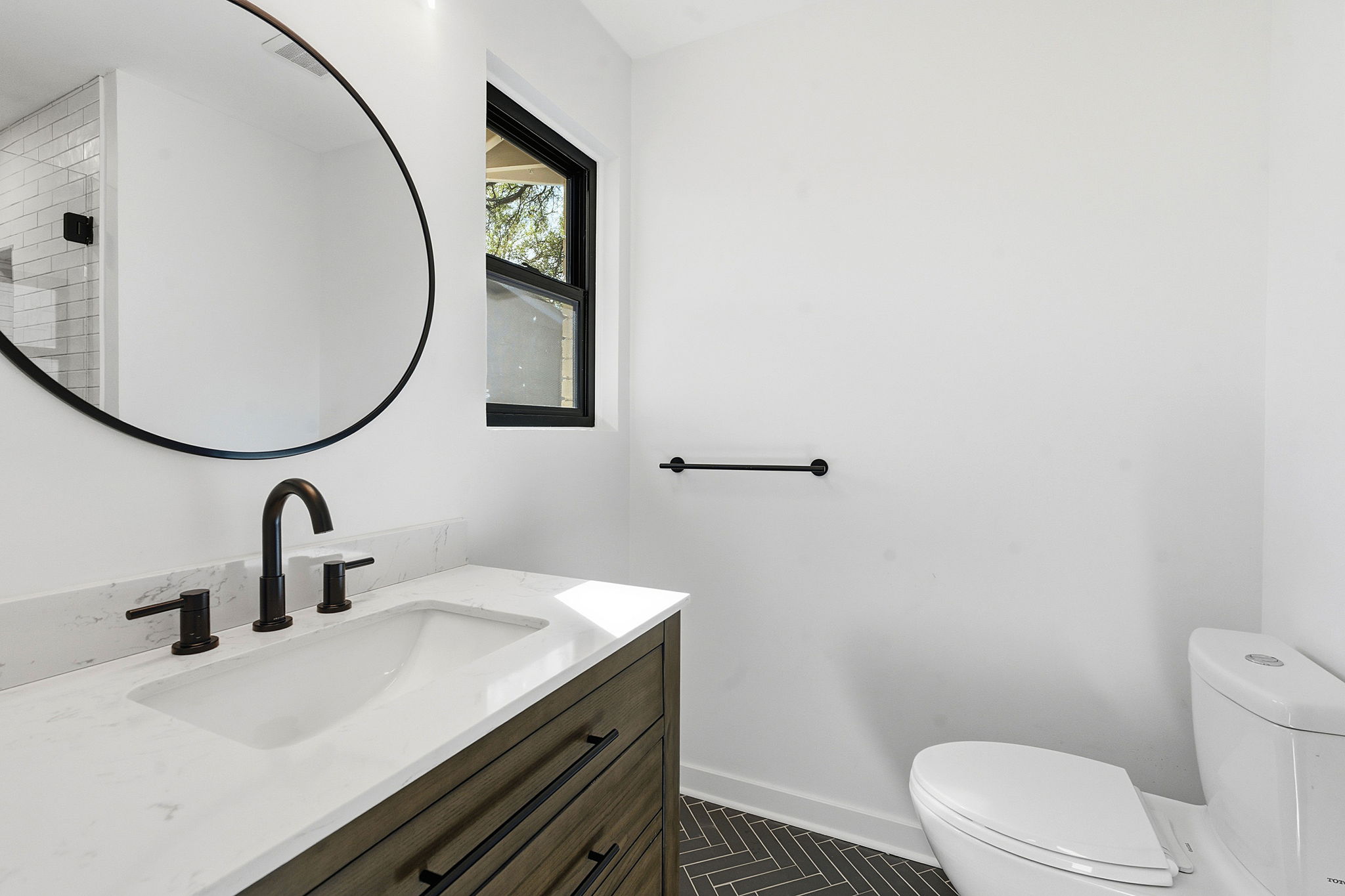 5609 Mapleleaf Drive Austin, TX 78723 - Photo 11 of 19 Bathroom with vanity and dark tile patterned flooring