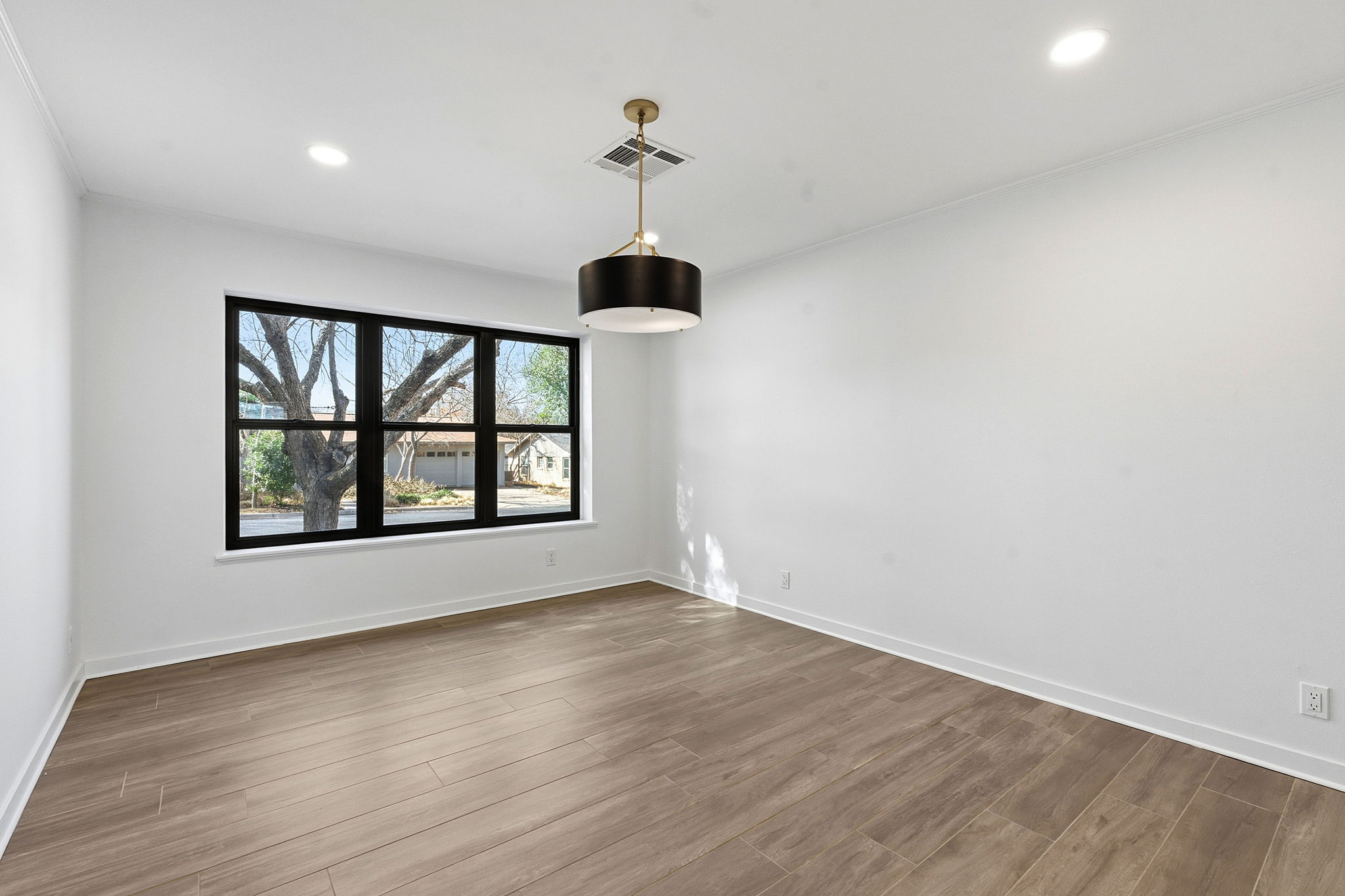 5609 Mapleleaf Drive Austin, TX 78723 - Photo 13 of 19 Unfurnished room with wood finished floors and recessed lighting