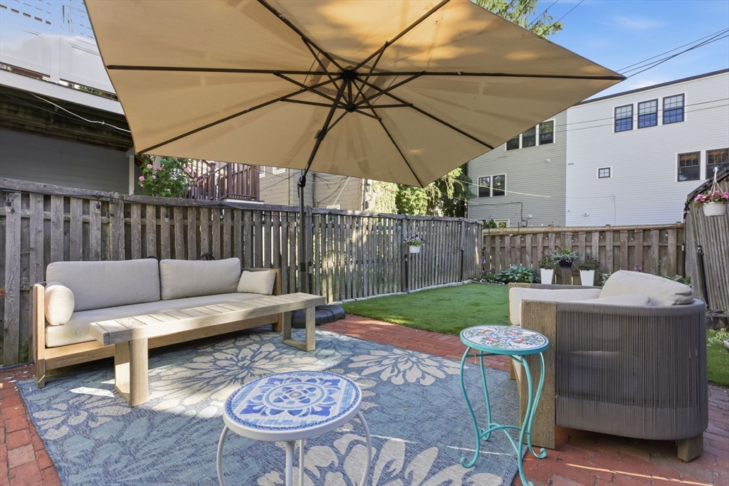 38 Bartlett Street Boston, MA 02129 - Photo 13 of 37 a view of a patio with furniture