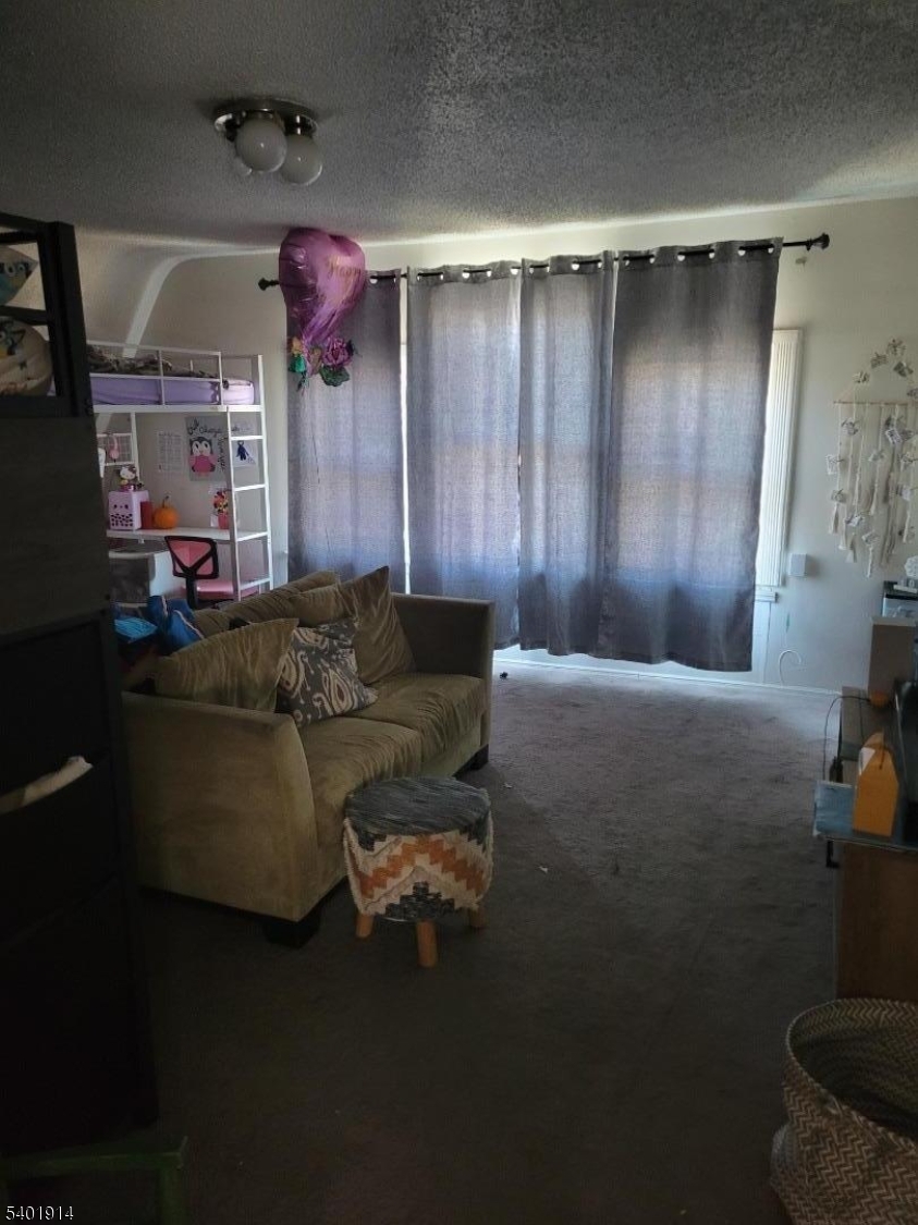 425 Main Street West Orange, NJ 07052 - Photo 11 of 20 a living room with furniture and a ceiling fan