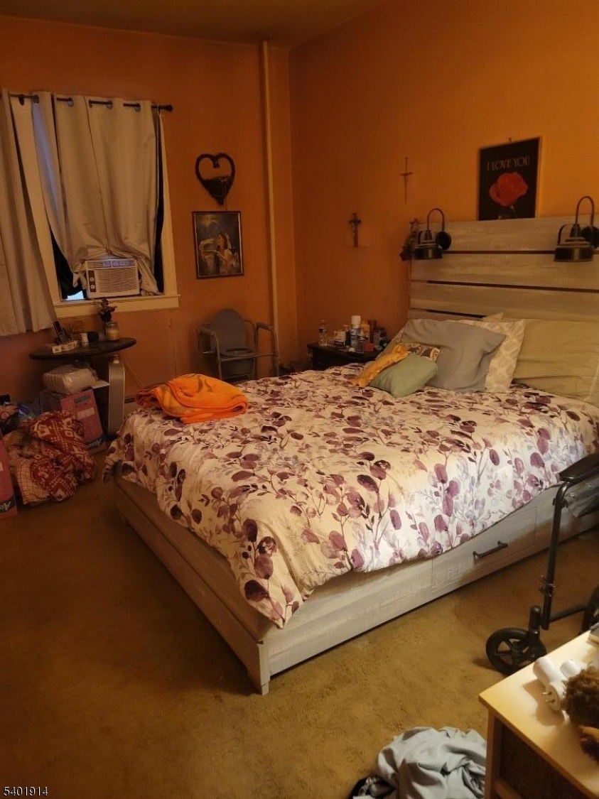 425 Main Street West Orange, NJ 07052 - Photo 18 of 20 a bed sitting in a bedroom next to a window