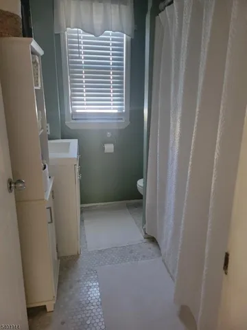 a view of a bathroom with a window