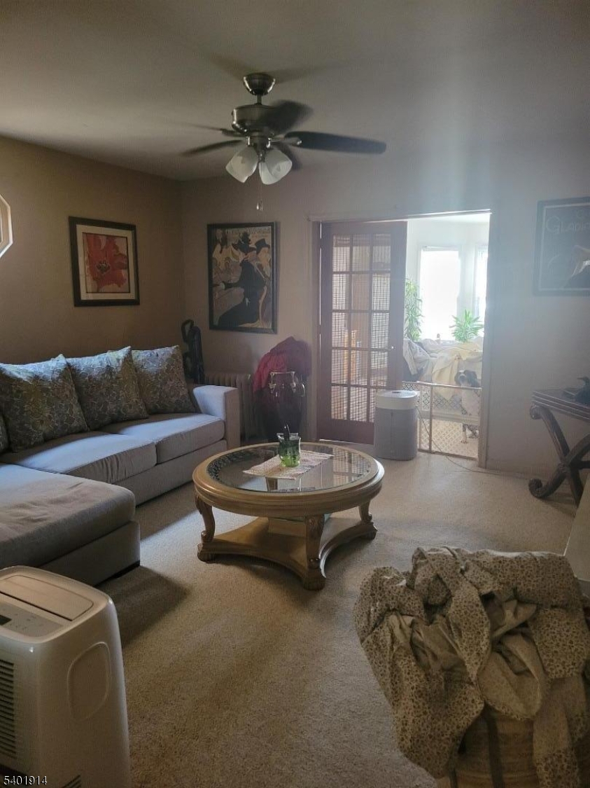425 Main Street West Orange, NJ 07052 - Photo 7 of 20 a living room with furniture and a large window