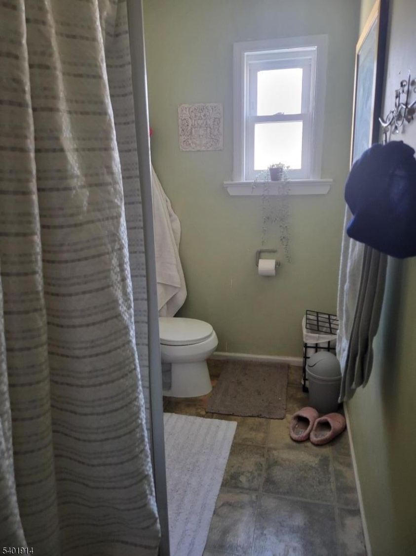 425 Main Street West Orange, NJ 07052 - Photo 10 of 20 a bathroom with a toilet and a shower