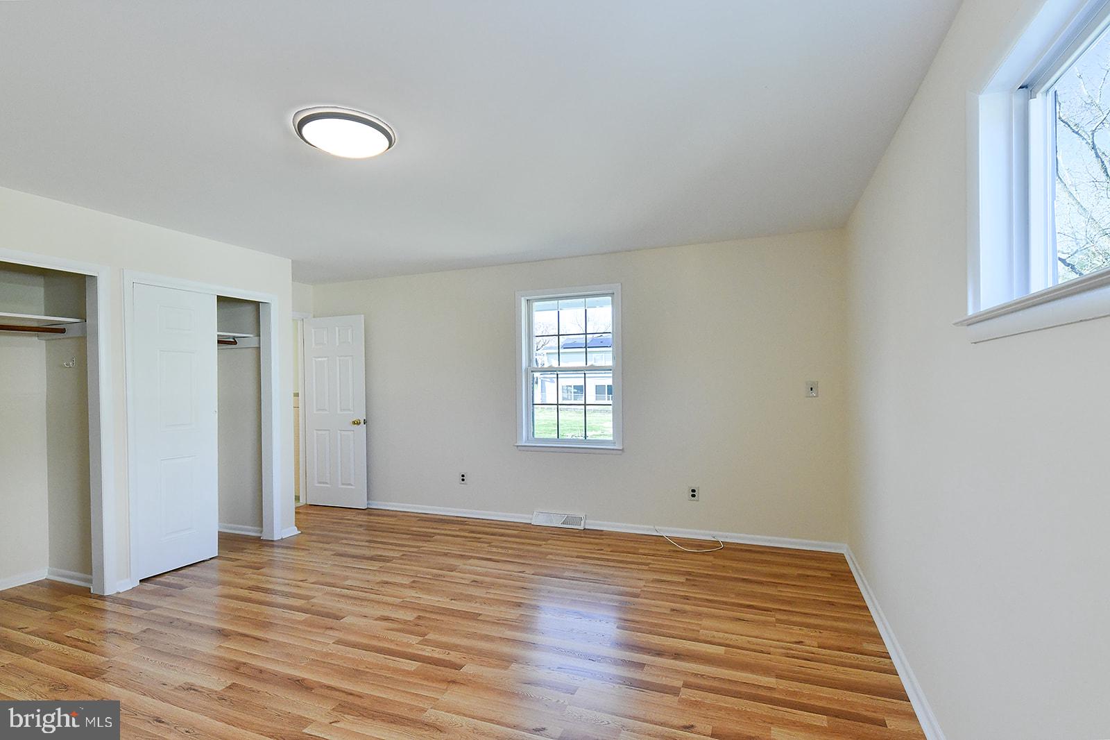 3702 East Joppa Road Nottingham, MD 21236 - Photo 28 of 65 a view of empty room with wooden floor and fan