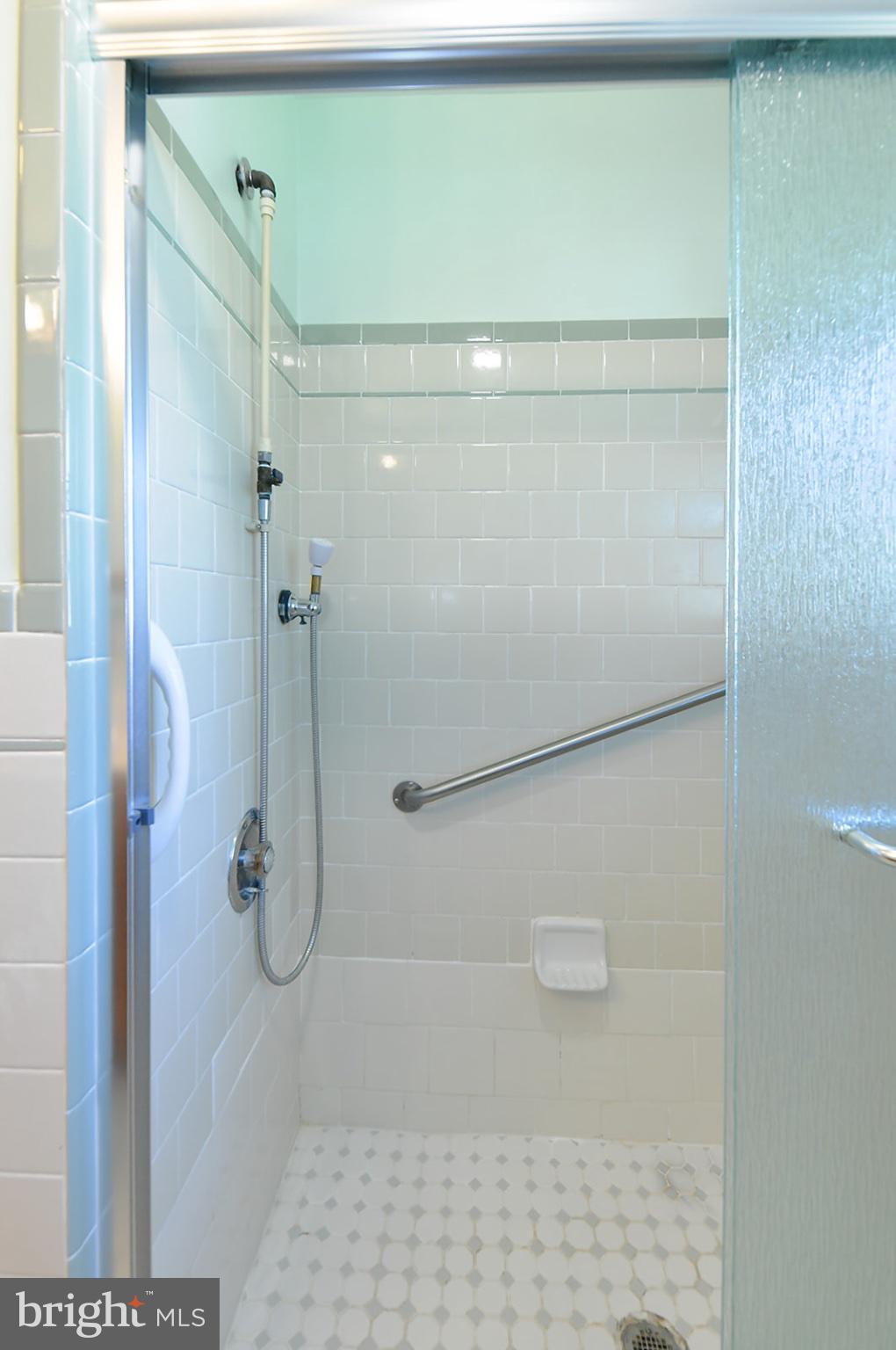 3702 East Joppa Road Nottingham, MD 21236 - Photo 32 of 65 a bathroom with a glass shower door
