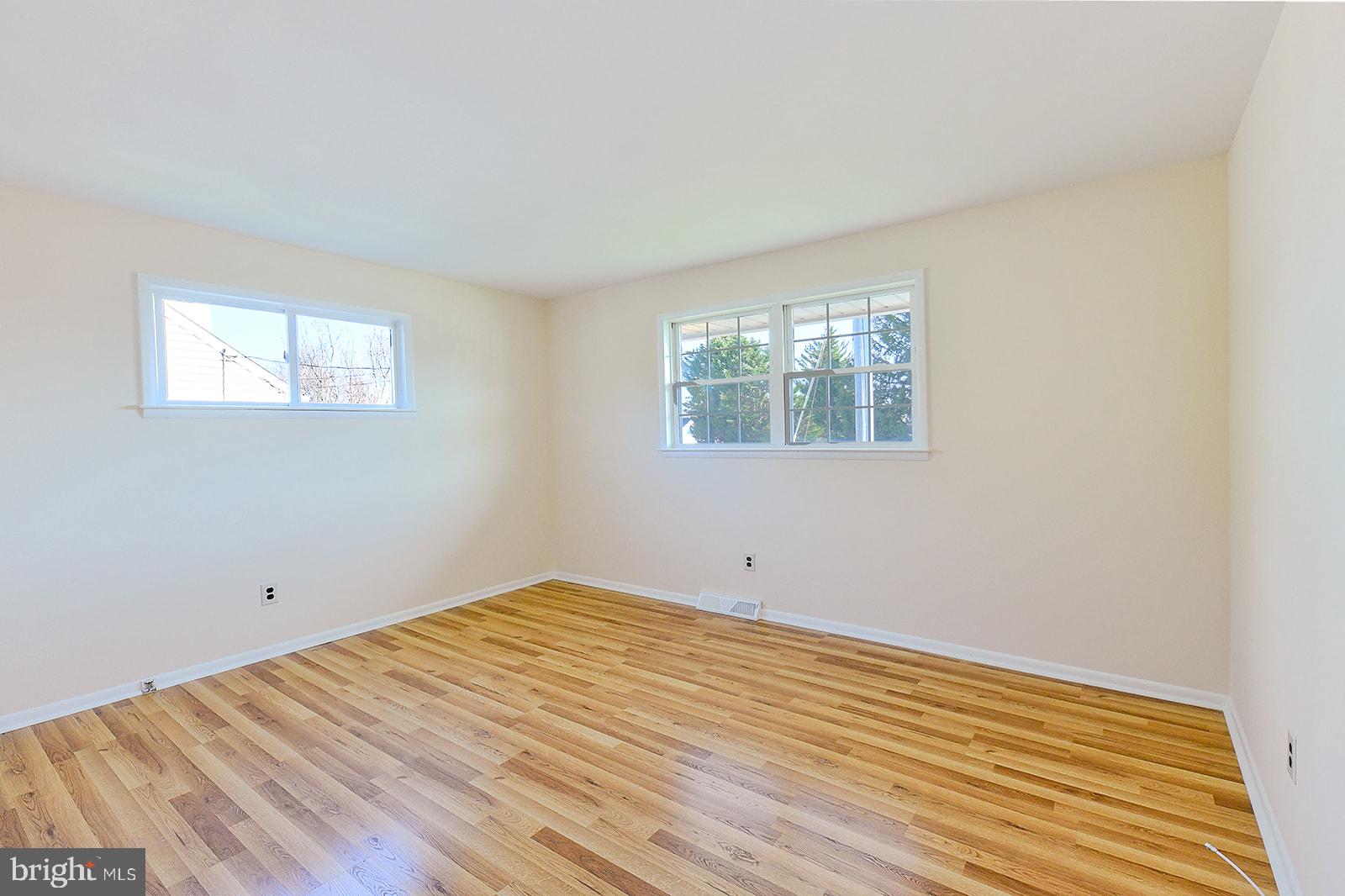 3702 East Joppa Road Nottingham, MD 21236 - Photo 35 of 65 an empty room with wooden floor and windows