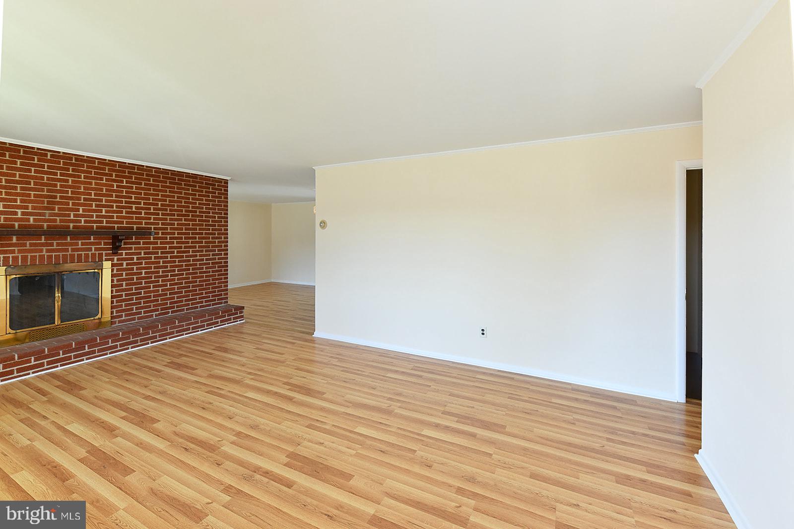 3702 East Joppa Road Nottingham, MD 21236 - Photo 4 of 65 a view of an empty room with wooden floor