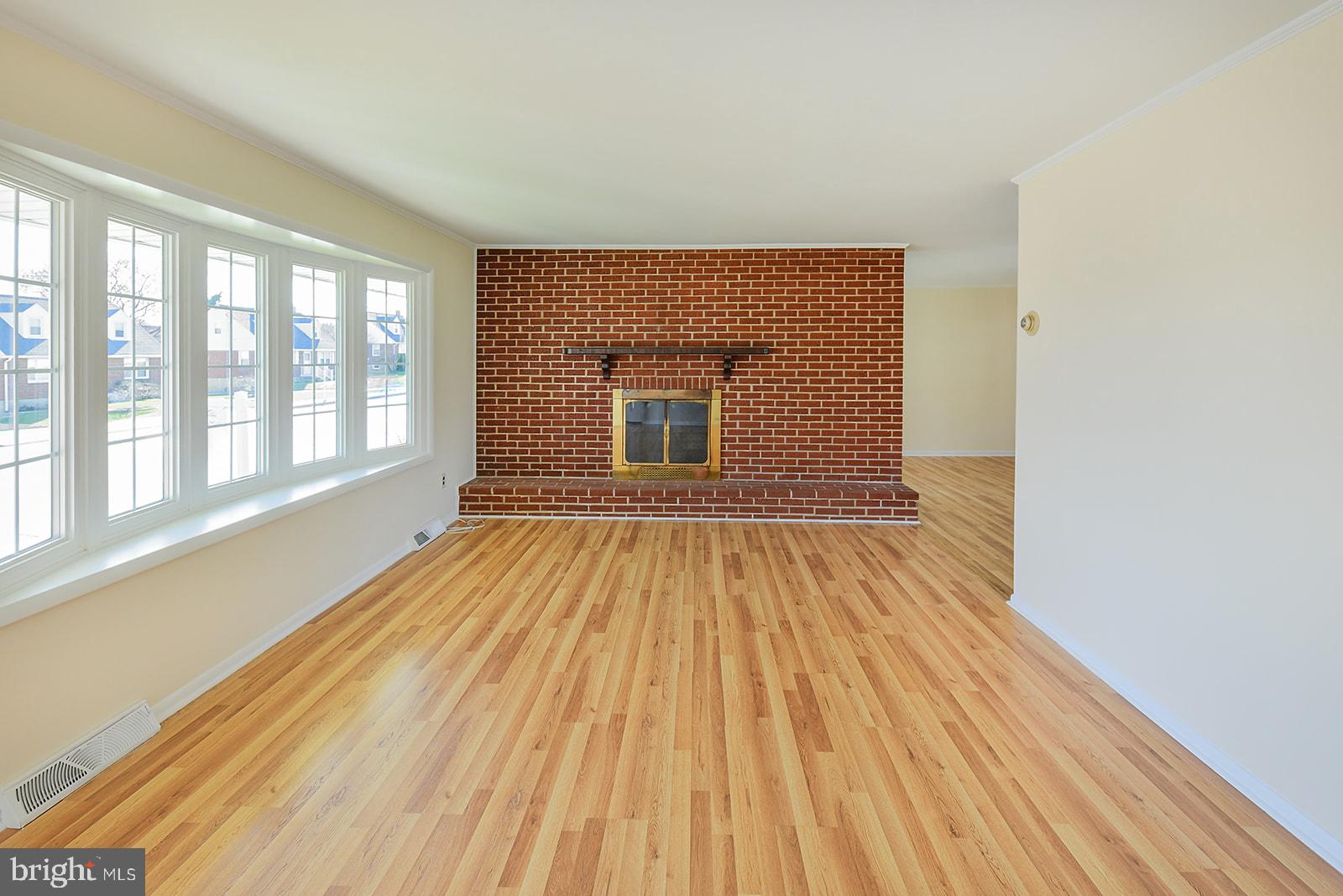 3702 East Joppa Road Nottingham, MD 21236 - Photo 5 of 65 wooden floor in an empty room with a window