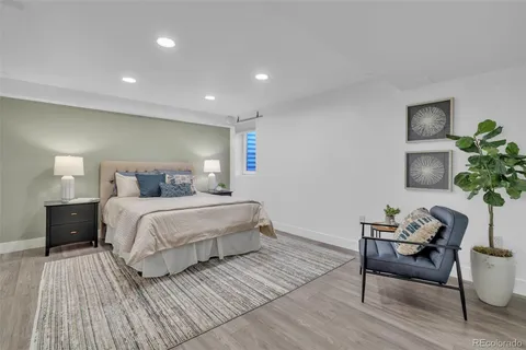 a bedroom with a bed and a table